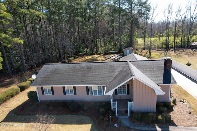 exterior space with a wooded view