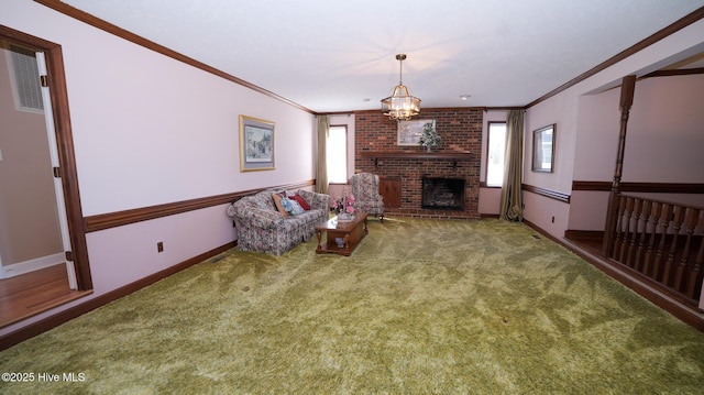 carpeted living room with an inviting chandelier, a brick fireplace, baseboards, and ornamental molding