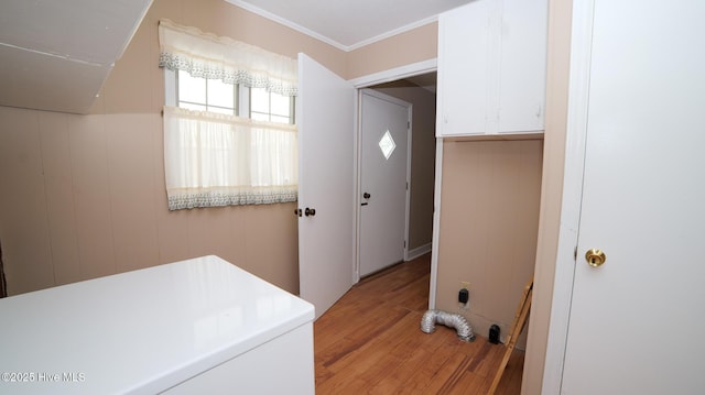 laundry room with laundry area and light wood-type flooring