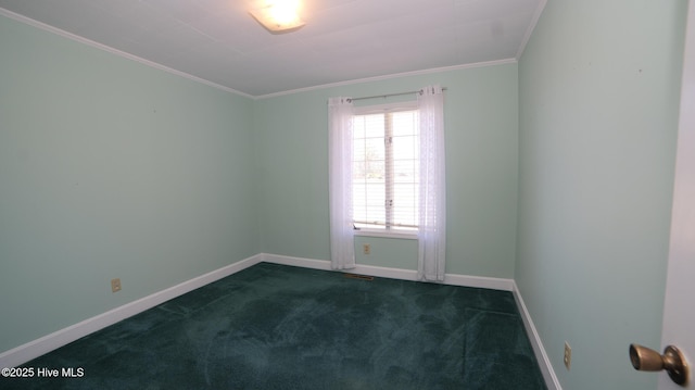 unfurnished room with crown molding, baseboards, and carpet floors