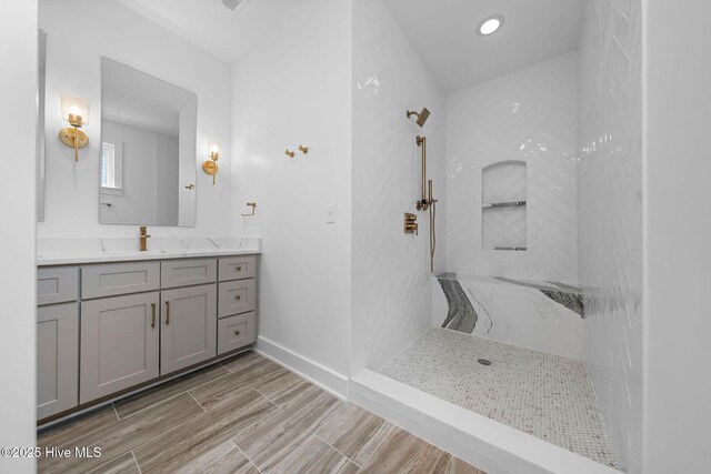 304 Alabama Ave Unit 2, Carolina Beach, NC 28428 - full bath with walk in shower, recessed lighting, wood tiled floor, and vanity
