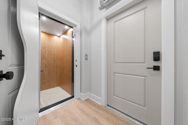304 Alabama Ave Unit 2, Carolina Beach, NC 28428 - doorway featuring baseboards and wood finished floors
