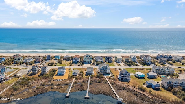 birds eye view of property with a residential view and a water view