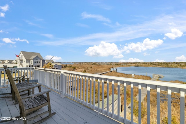 wooden deck featuring a water view