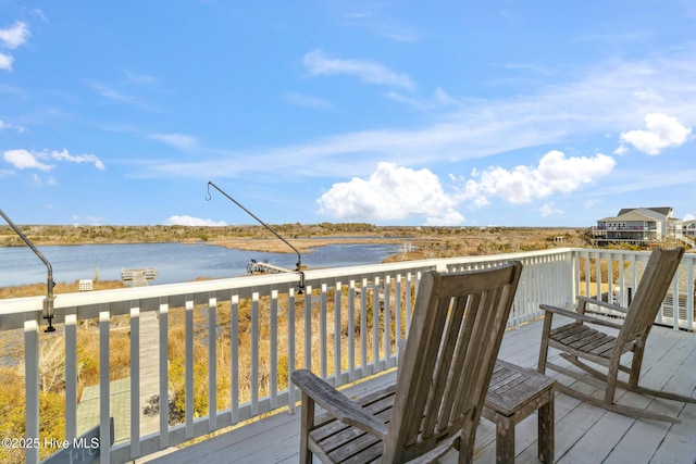 wooden terrace with a water view