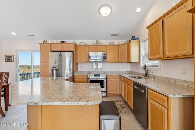 kitchen featuring light tile patterned flooring, visible vents, appliances with stainless steel finishes, and a sink