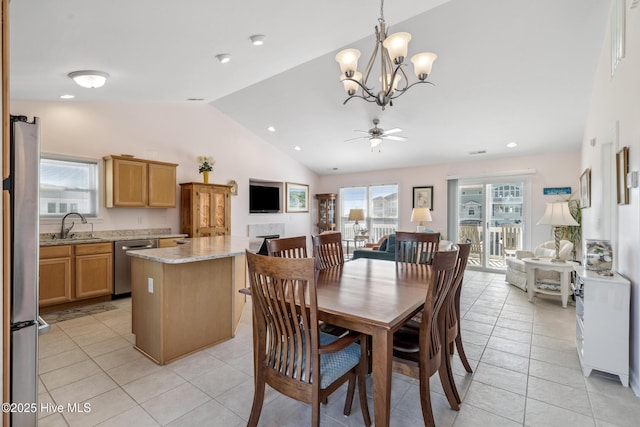 dining room with lofted ceiling, light tile patterned flooring, and ceiling fan with notable chandelier