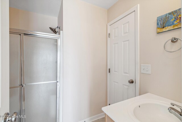 full bathroom with vanity and an enclosed shower