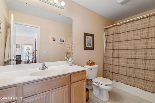 bathroom featuring visible vents, toilet, vanity, and tile patterned flooring