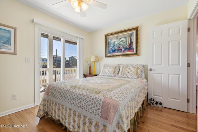 bedroom featuring access to exterior, ceiling fan, baseboards, and hardwood / wood-style floors