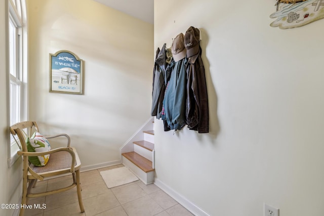 interior space featuring baseboards and tile patterned flooring