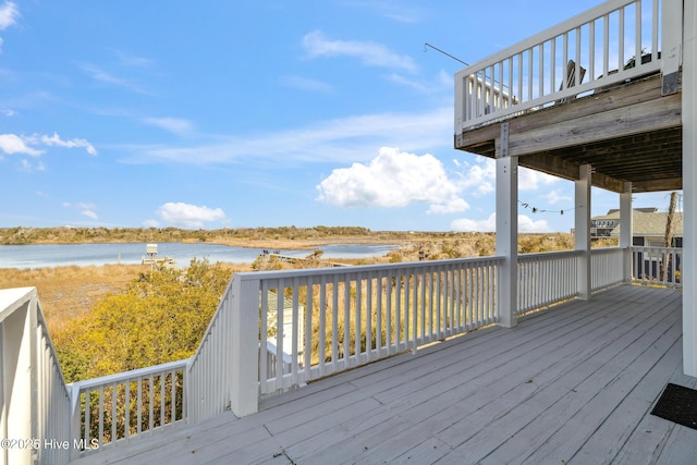 wooden terrace with a water view