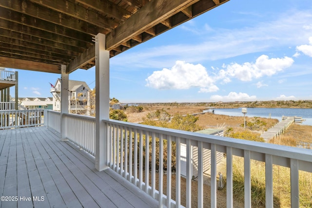 wooden deck with a water view