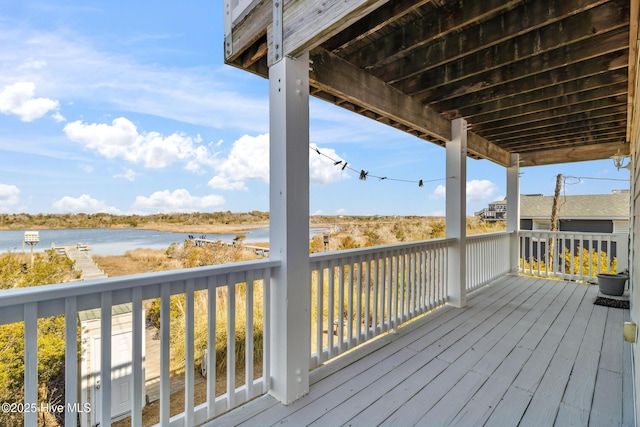 wooden deck with a water view