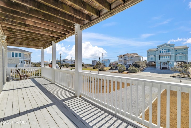 wooden deck with a residential view