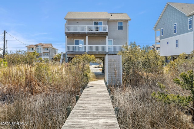 back of house with a balcony