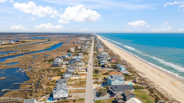 bird's eye view with a view of the beach and a water view