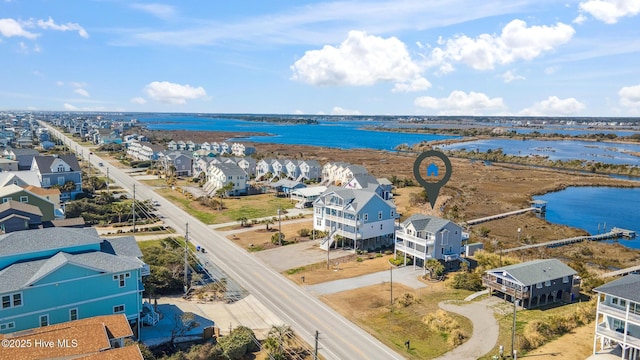 aerial view featuring a residential view and a water view