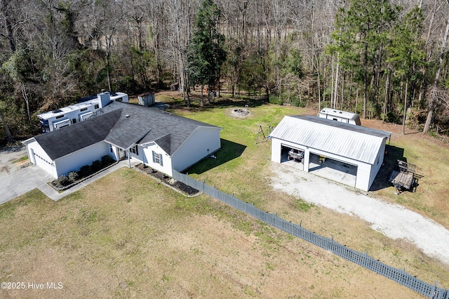 birds eye view of property with a wooded view