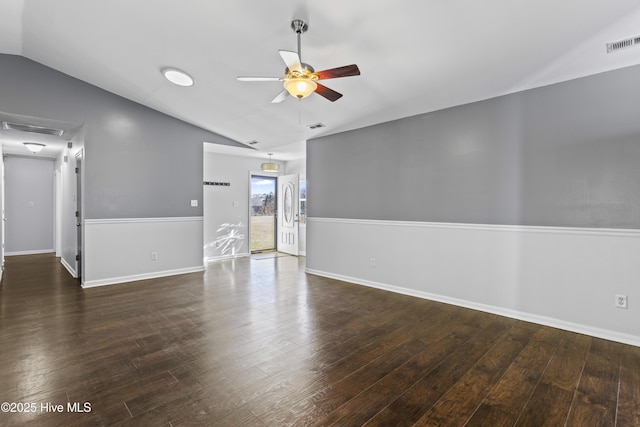 unfurnished living room with ceiling fan, visible vents, wood finished floors, and vaulted ceiling