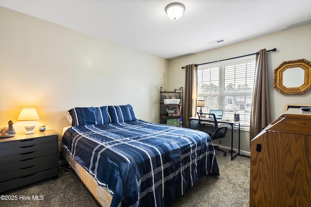 bedroom with a textured ceiling, carpet, visible vents, and baseboards