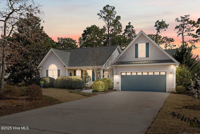 view of front of property with driveway and an attached garage