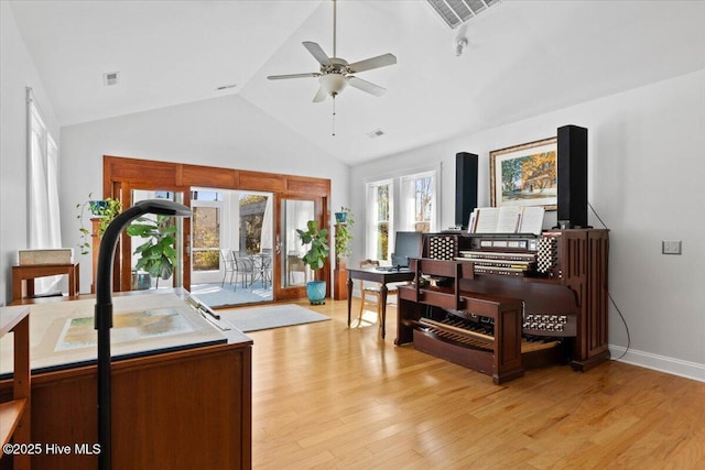 living area with ceiling fan, visible vents, and light wood-style flooring