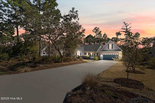 view of front of home featuring a garage and driveway