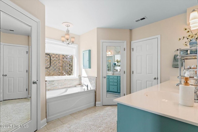 full bath with tile patterned flooring, visible vents, vanity, and a bath