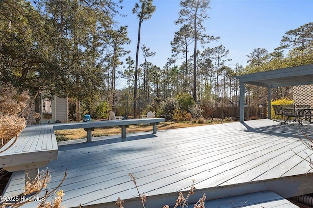 wooden deck with outdoor dining space