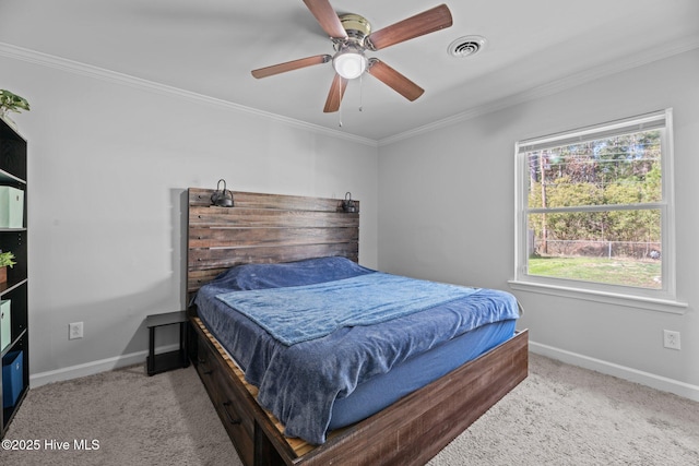 carpeted bedroom with ceiling fan, visible vents, baseboards, and ornamental molding