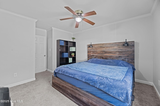 carpeted bedroom featuring a ceiling fan, baseboards, and ornamental molding