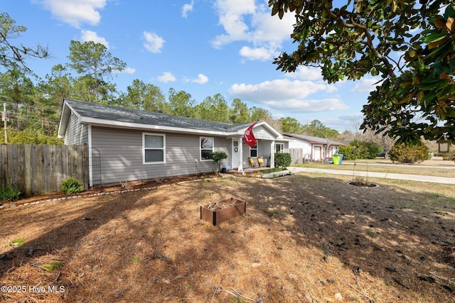 single story home with fence