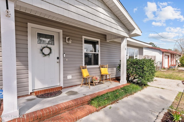 entrance to property with covered porch