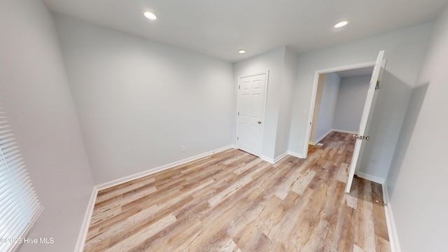 unfurnished bedroom with recessed lighting, baseboards, and light wood finished floors