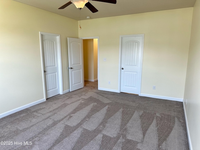 unfurnished bedroom featuring a ceiling fan, baseboards, and carpet