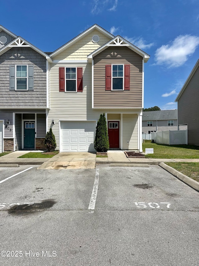 view of property featuring uncovered parking