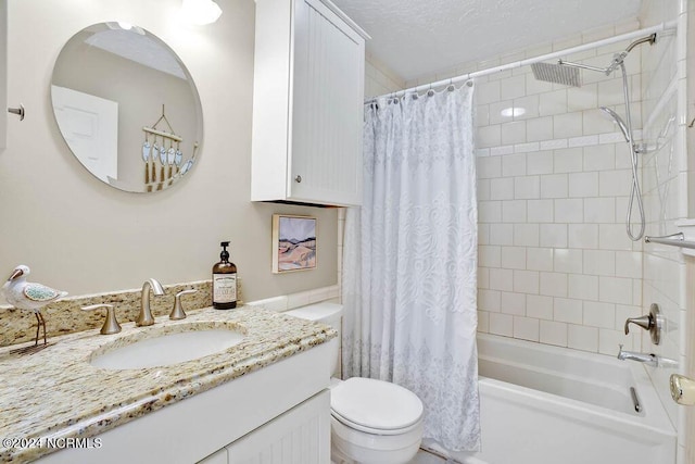 full bathroom with vanity, toilet, shower / tub combo, and a textured ceiling