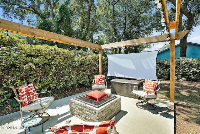 view of patio / terrace featuring an outdoor fire pit