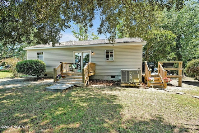 back of house with a wooden deck, a yard, central AC unit, and crawl space