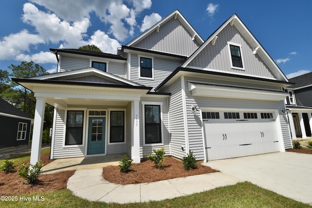 view of front facade featuring a garage, covered porch, board and batten siding, and concrete driveway