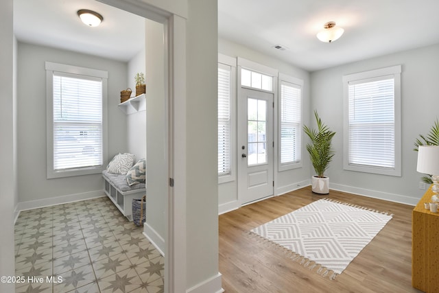 entryway with visible vents and baseboards