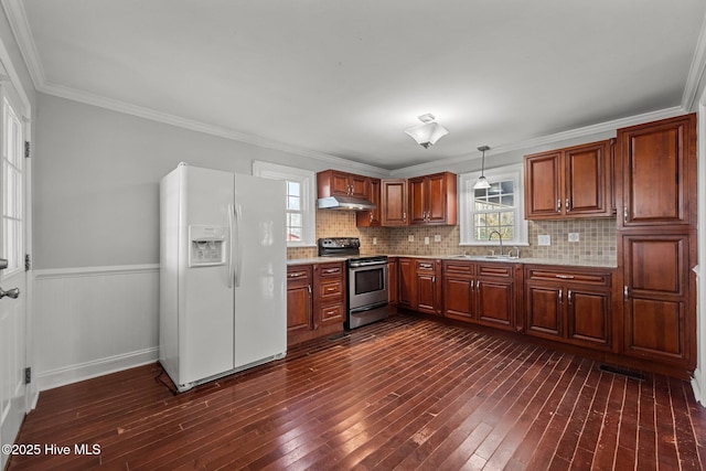 kitchen featuring dark wood-type flooring, stainless steel range with electric stovetop, under cabinet range hood, a sink, and white fridge with ice dispenser