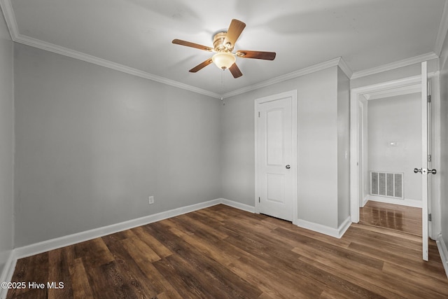 unfurnished bedroom with visible vents, baseboards, ornamental molding, a ceiling fan, and dark wood-style flooring