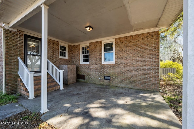 view of patio / terrace featuring an attached carport and central air condition unit