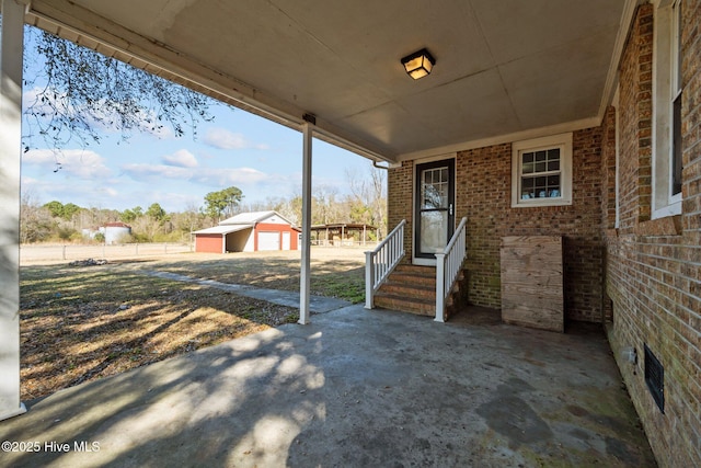 view of patio featuring an outdoor structure