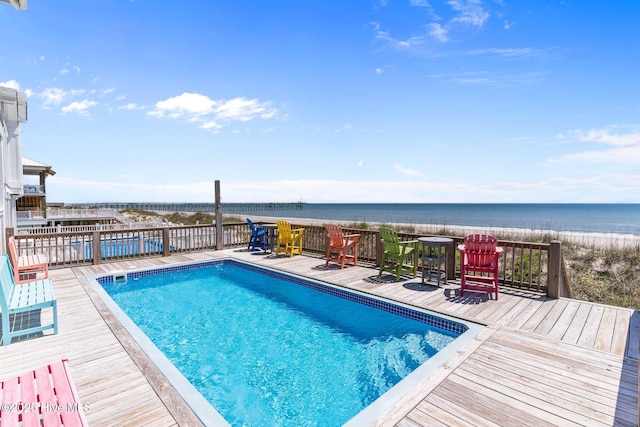 pool featuring a deck with water view