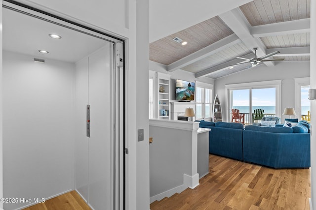 living area featuring a ceiling fan, light wood-type flooring, wooden ceiling, vaulted ceiling with beams, and recessed lighting