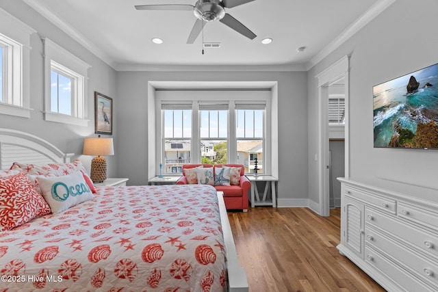 bedroom featuring light wood-style floors, recessed lighting, crown molding, and visible vents