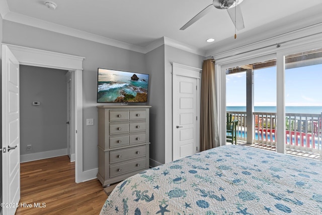bedroom with ceiling fan, crown molding, wood finished floors, baseboards, and access to outside